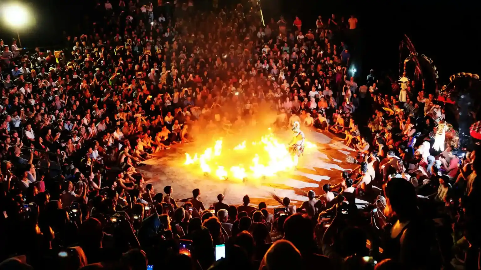 Kecak fire dance at Uluwatu with the crowd seated around the fire
