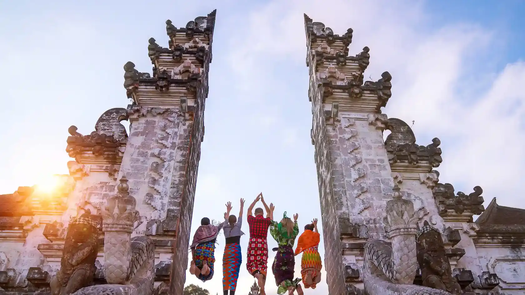 Travellers jumping in the Lempuyang split gate
