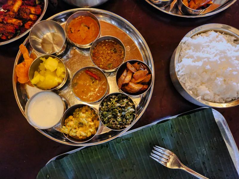 Vegetarian Indian thali with rice and side dishes